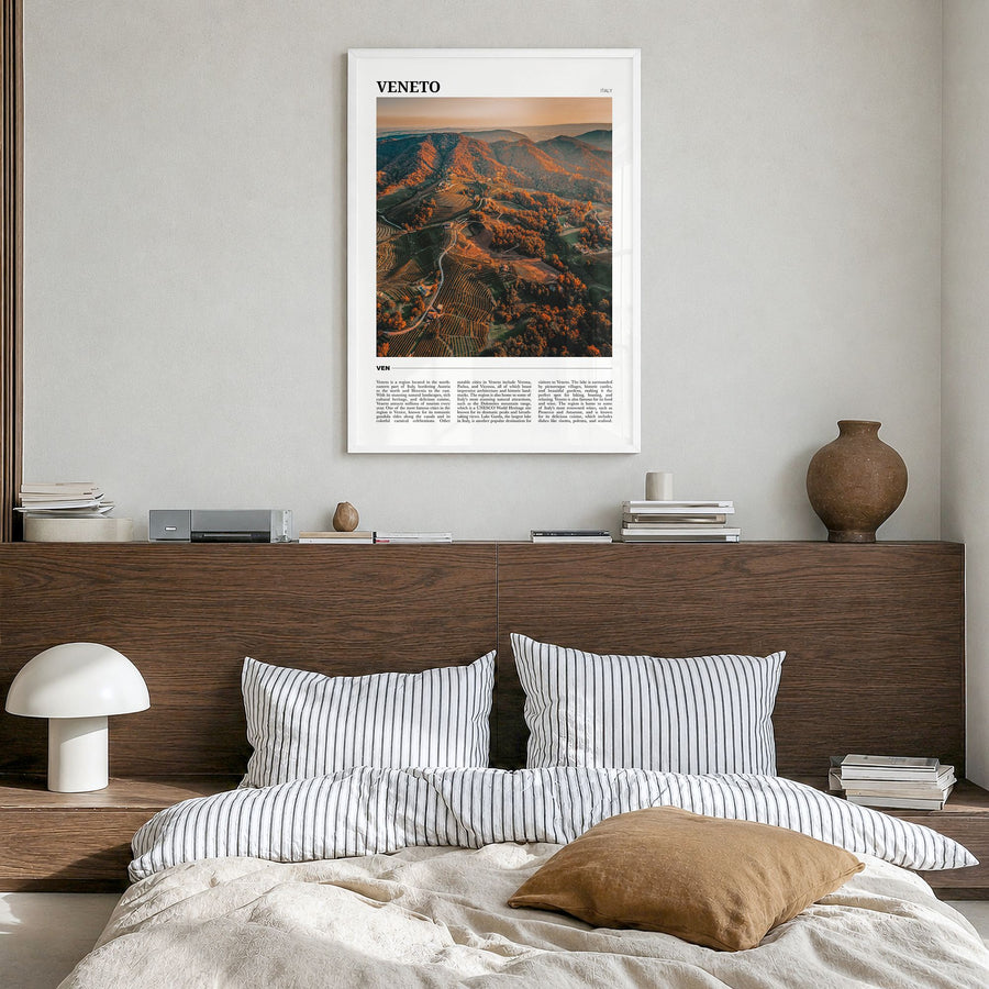 Veneto Travel Poster in a white wood frame, hanging in a bedroom