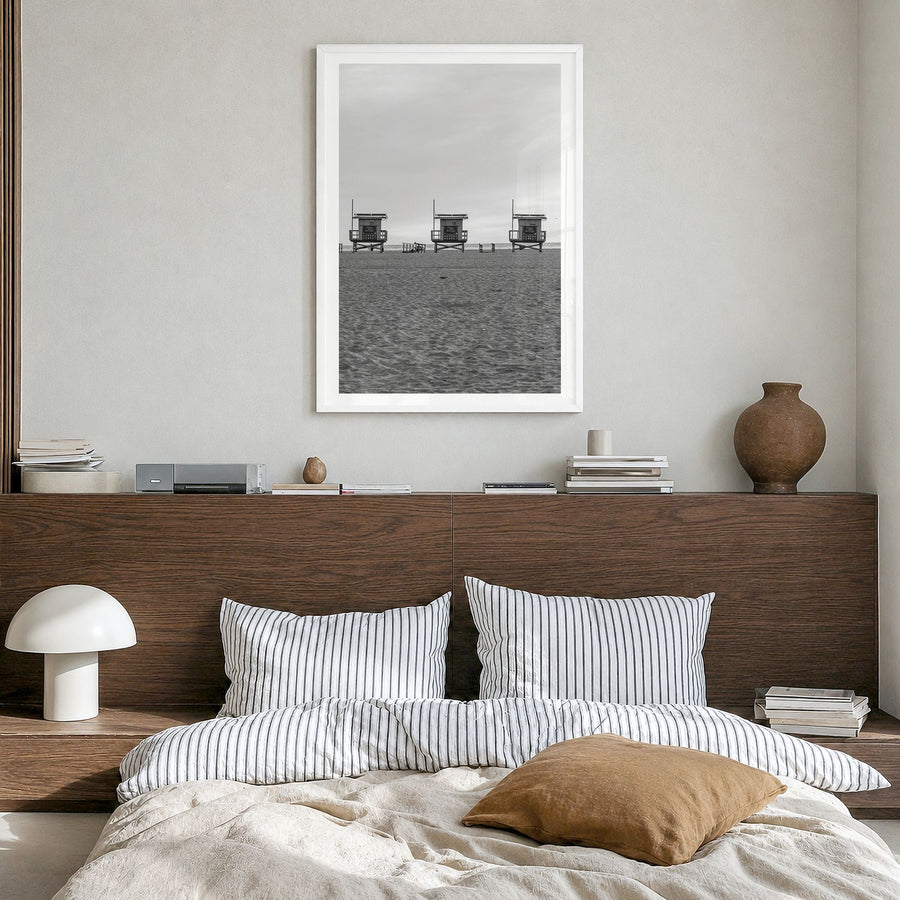 Venice Beach Photo Poster in a white wood frame, hanging in a bedroom, white border
