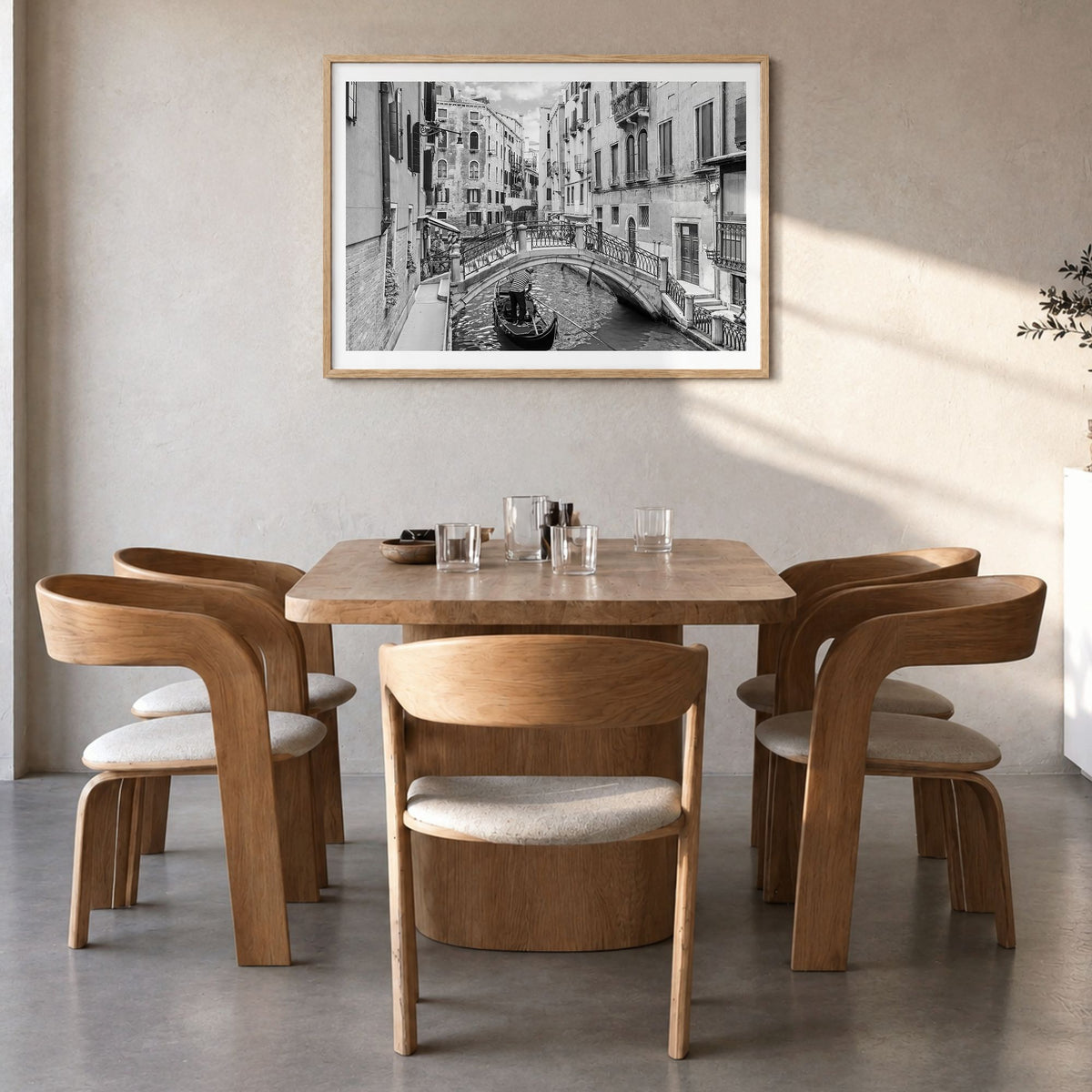 Venice Photo Poster in a natural wood frame, hanging in a dining room, white border