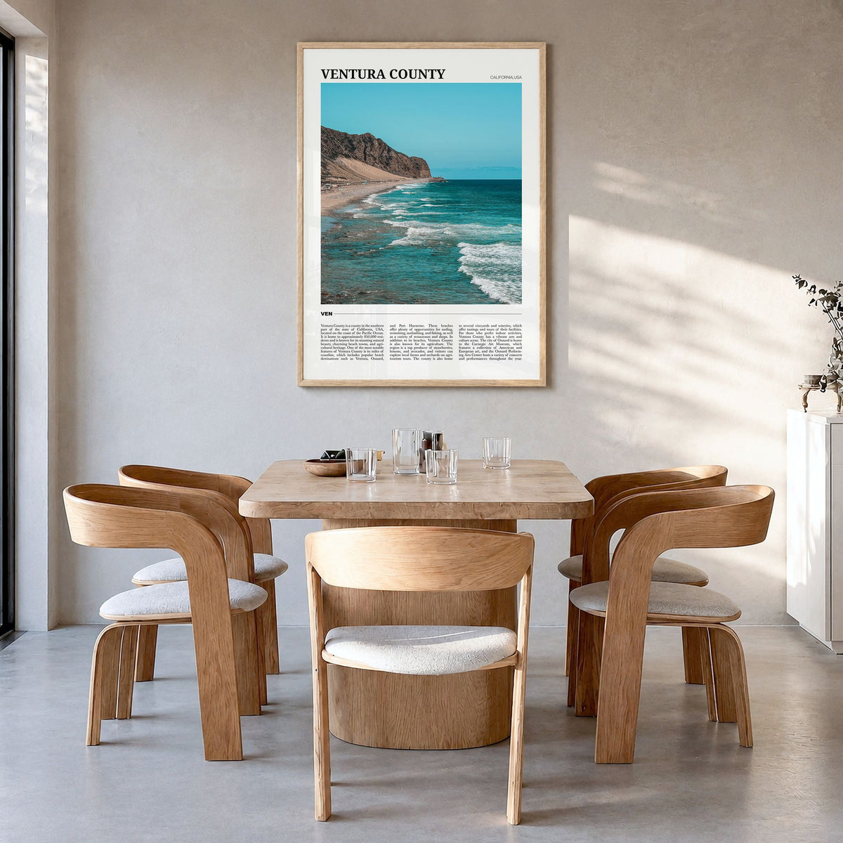 Ventura County Travel Poster in a natural wood frame, hanging in a dining room