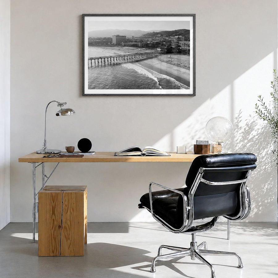 Ventura Photo No 2 Poster in a black wood frame, hanging in a bright home office, white border