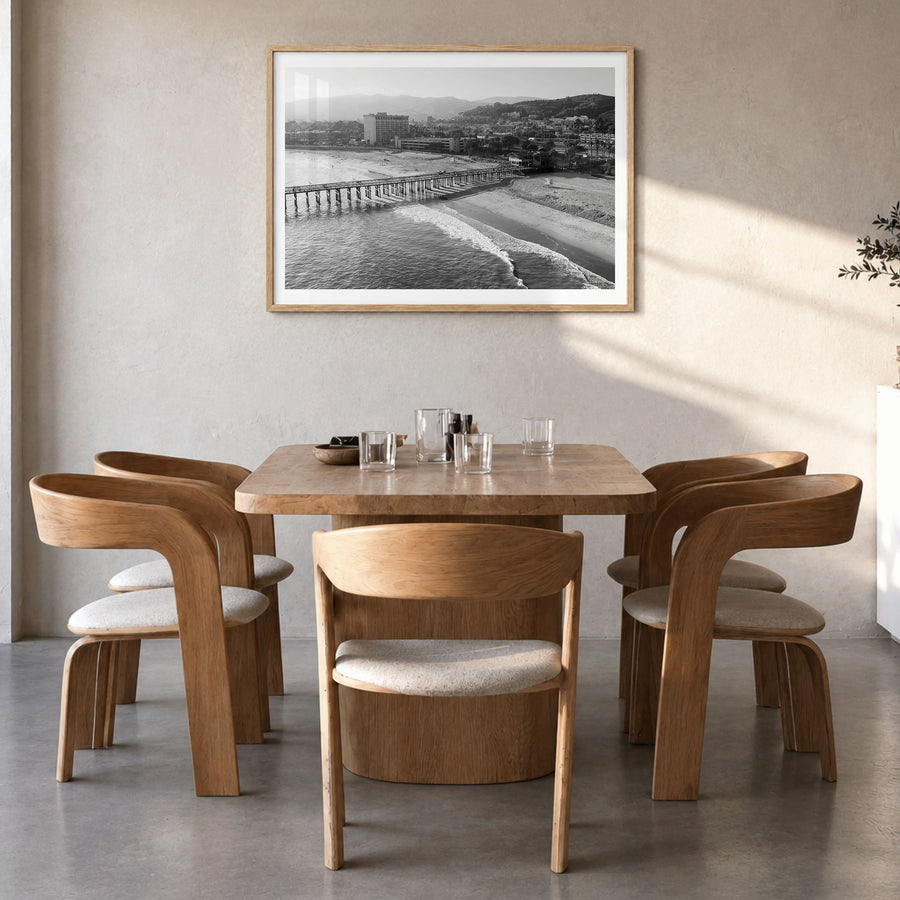 Ventura Photo No 2 Poster in a natural wood frame, hanging in a dining room, white border