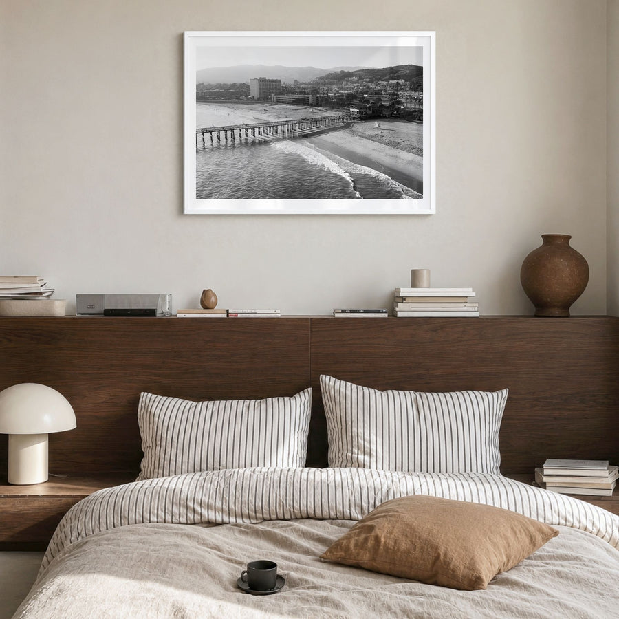 Ventura Photo No 2 Poster in a white wood frame, hanging in a bedroom, white border