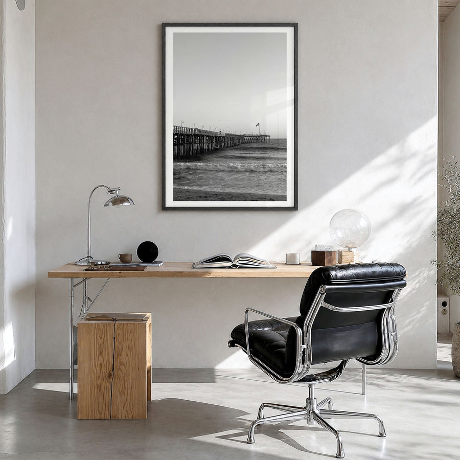 Ventura Photo No 1 Poster in a black wood frame, hanging in a bright home office, white border