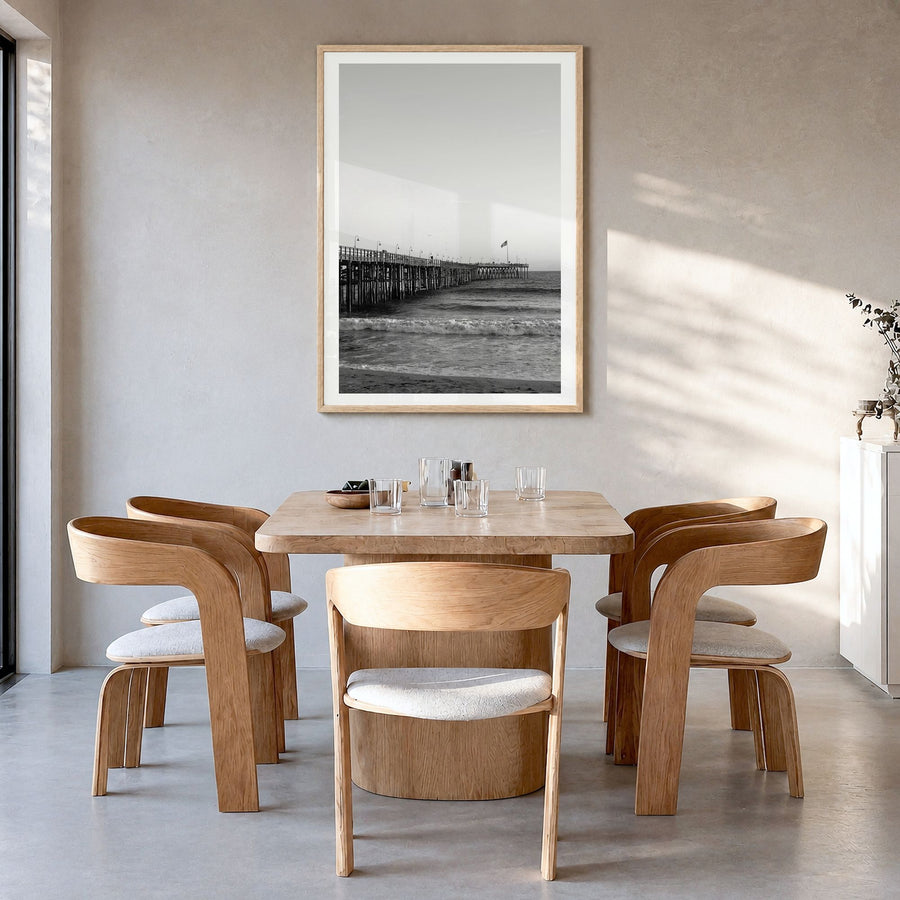 Ventura Photo No 1 Poster in a natural wood frame, hanging in a dining room, white border