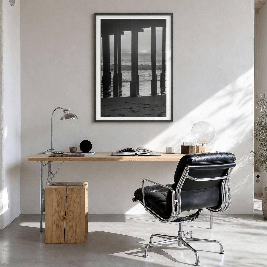 Ventura Photo No 2 Poster in a black wood frame, hanging in a bright home office, white border