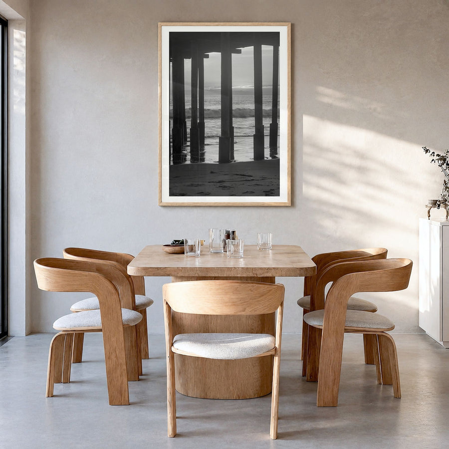Ventura Photo No 2 Poster in a natural wood frame, hanging in a dining room, white border