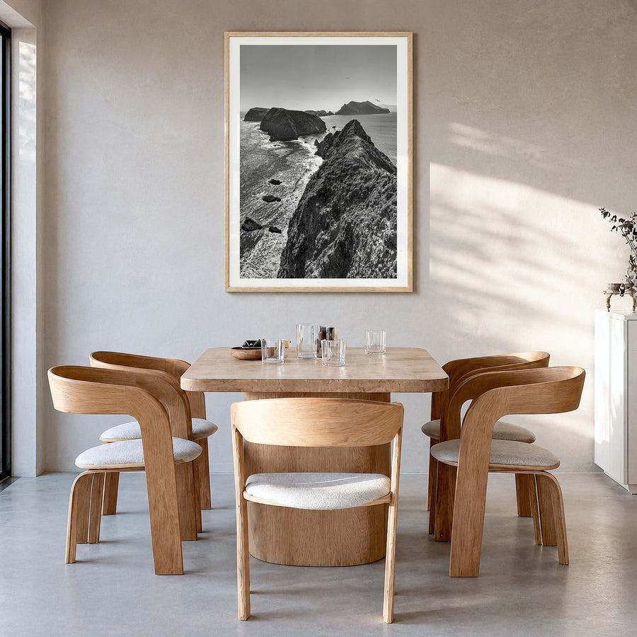 Ventura Photo No 3 Poster in a natural wood frame, hanging in a dining room, white border