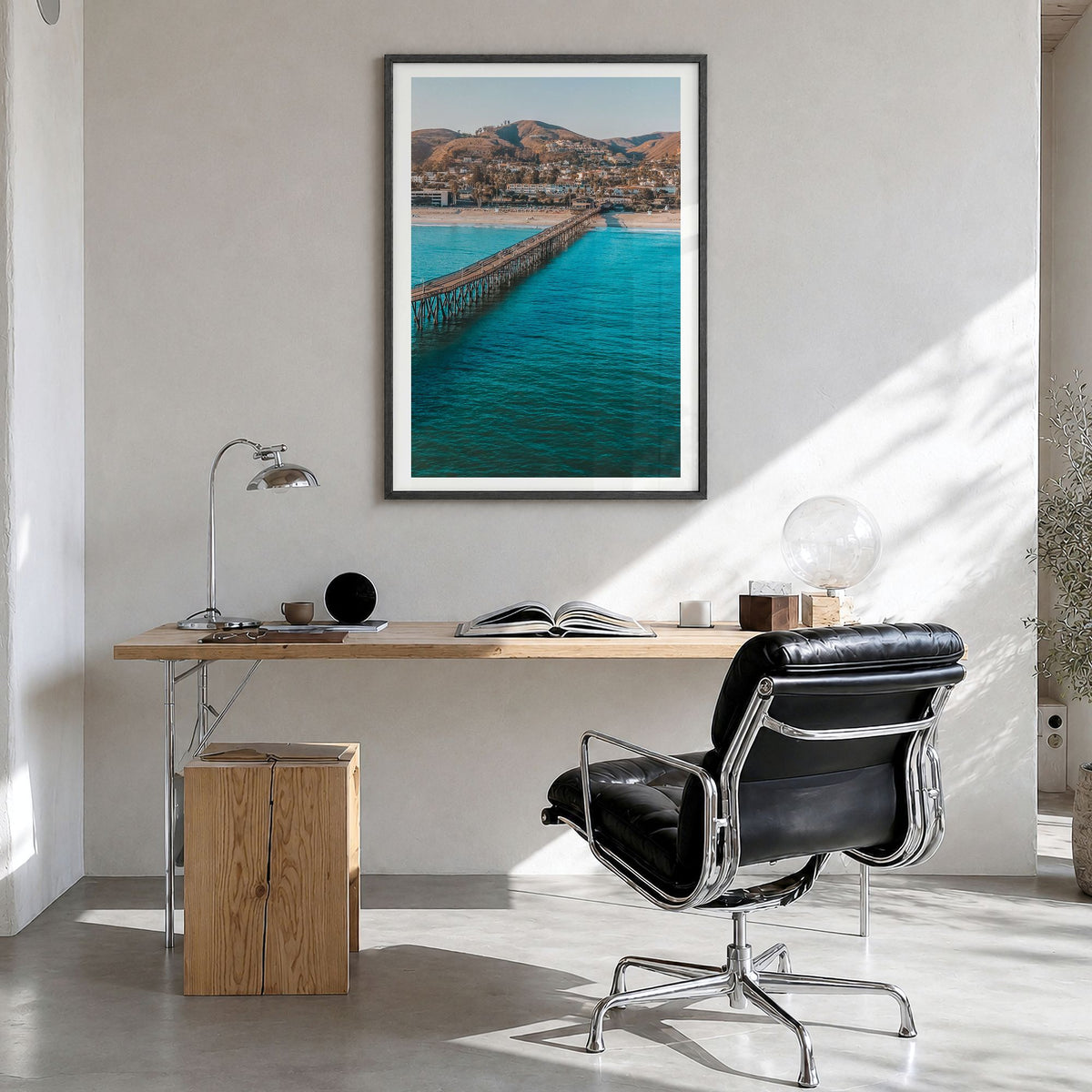Ventura Photo No 1 Poster in a black wood frame, hanging in a bright home office, white border