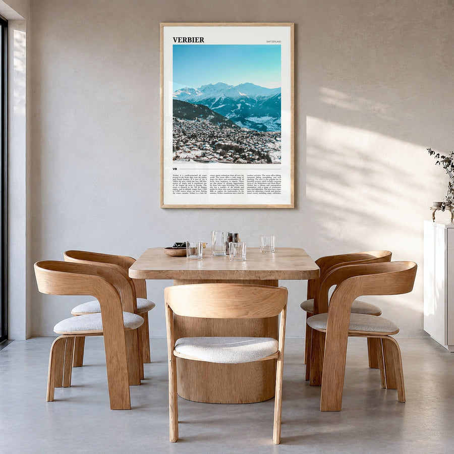 Verbier Travel Poster in a natural wood frame, hanging in a dining room