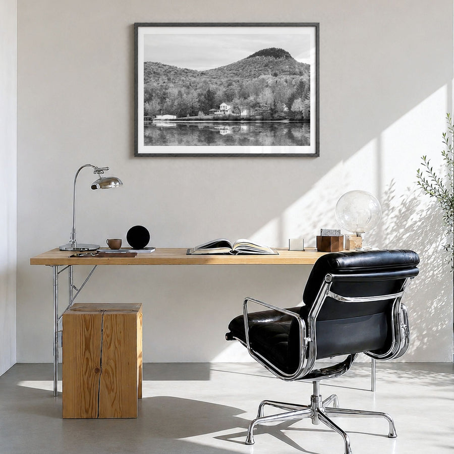 Vermont Photo Poster in a black wood frame, hanging in a bright home office, white border
