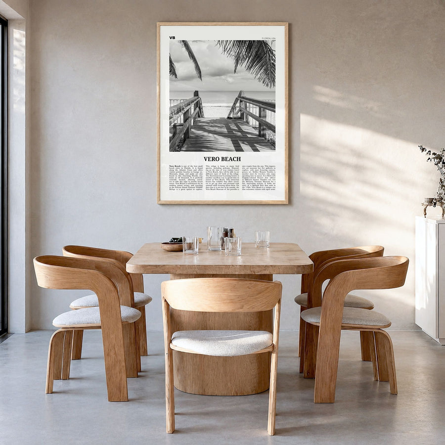 Vero Beach Newspaper Poster in a natural wood frame, hanging in a dining room