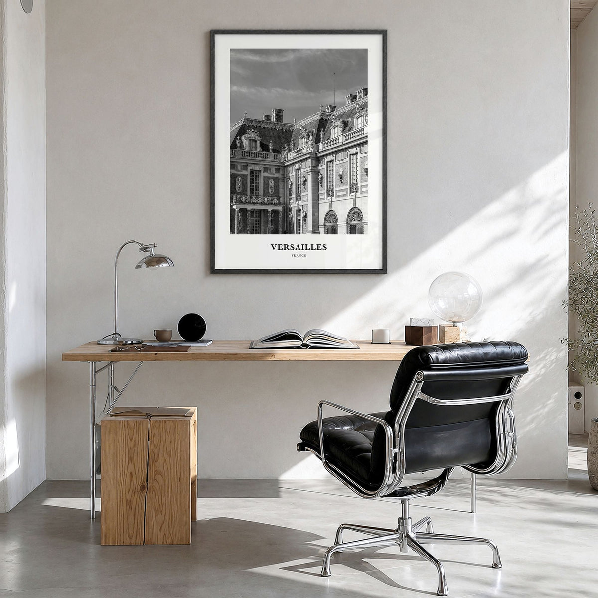 Versailles Classic Poster in a black wood frame, hanging in a bright home office