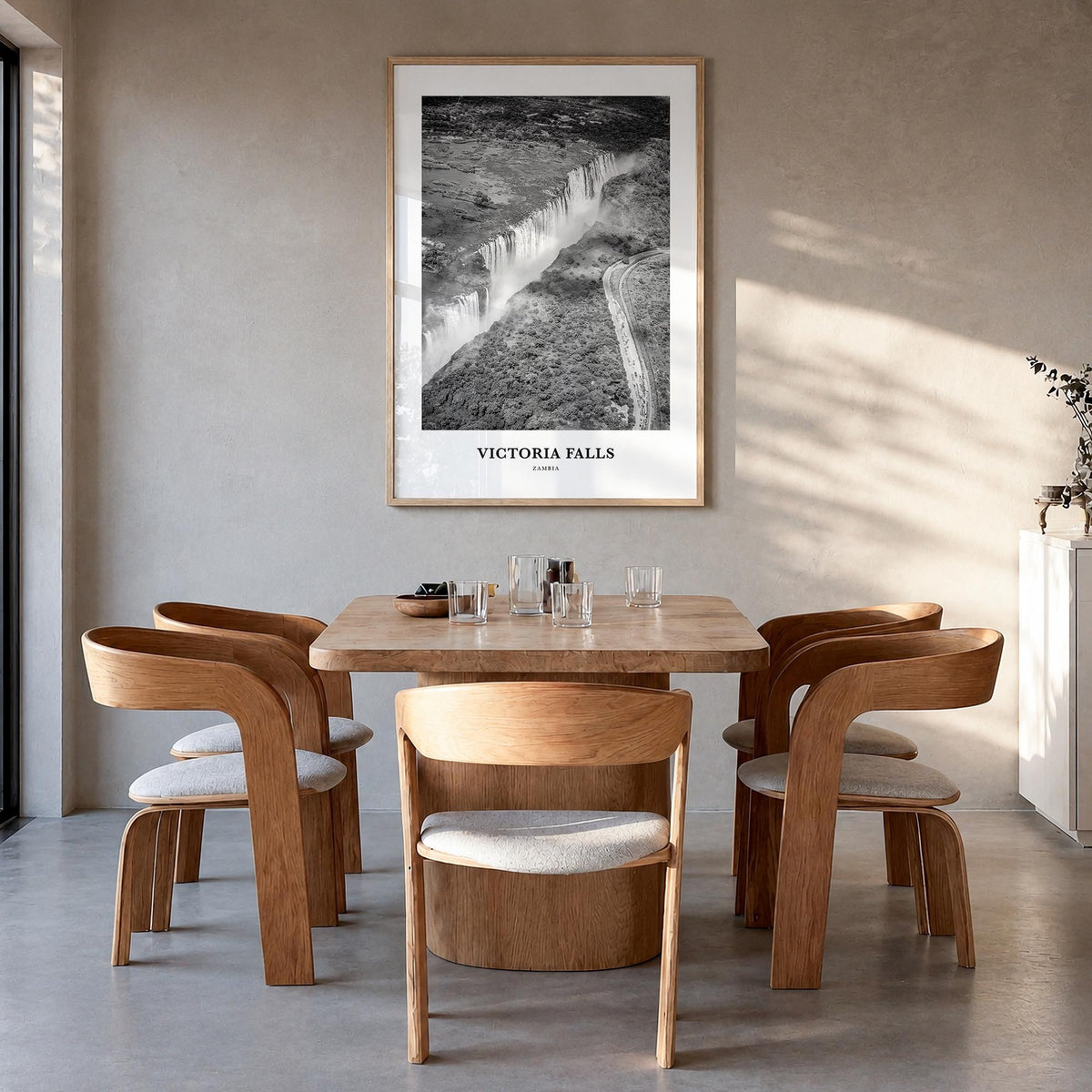 Victoria Falls black & white classic poster of Zambia & Zimbabwe – vertical wall art in natural wood frame, hanging on wall