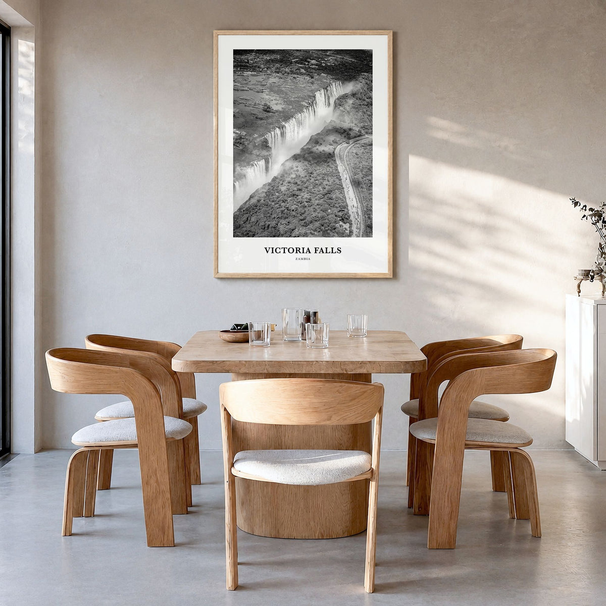 Victoria Falls Classic Poster in a natural wood frame, hanging in a dining room