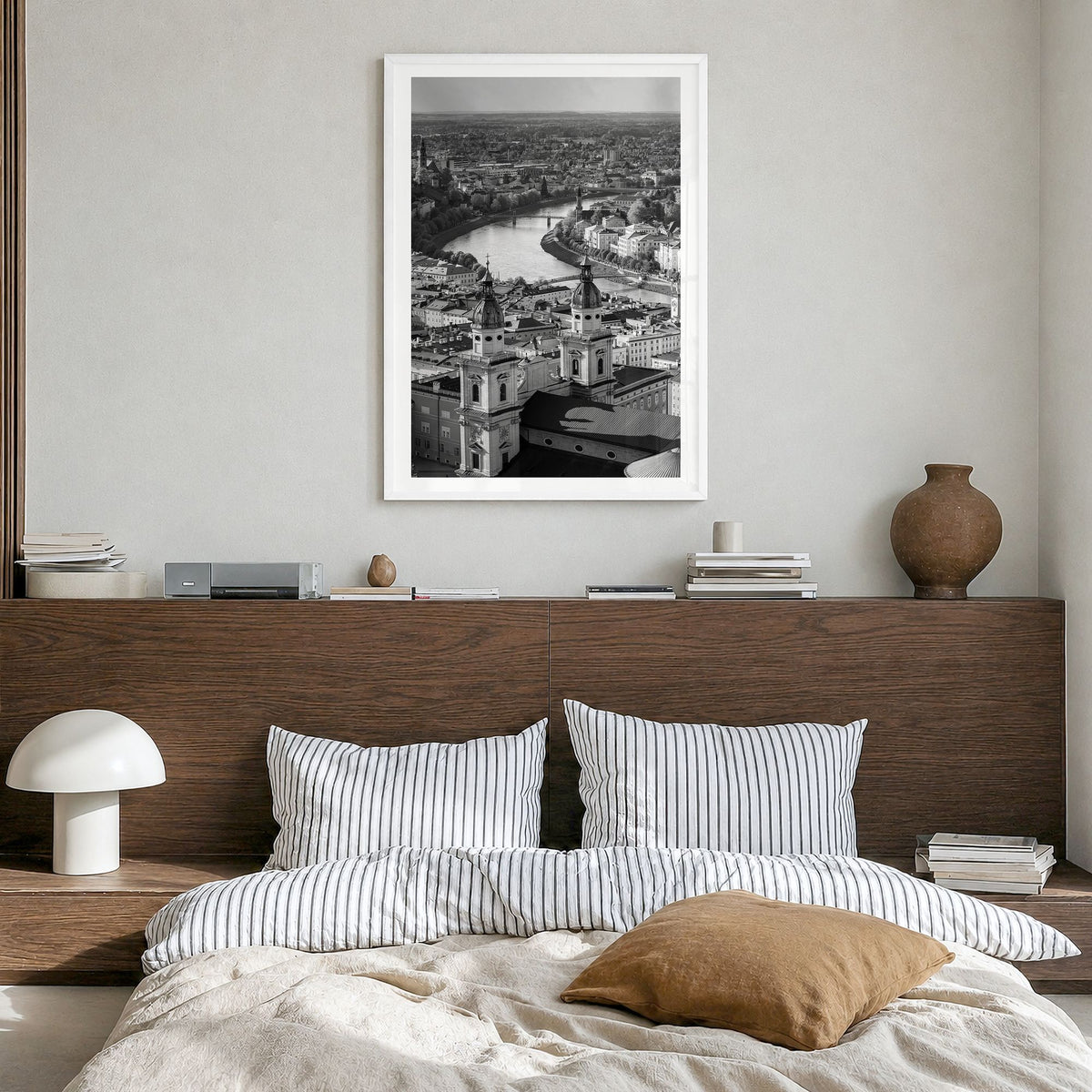 Vienna Photo Poster in a white wood frame, hanging in a bedroom, white border