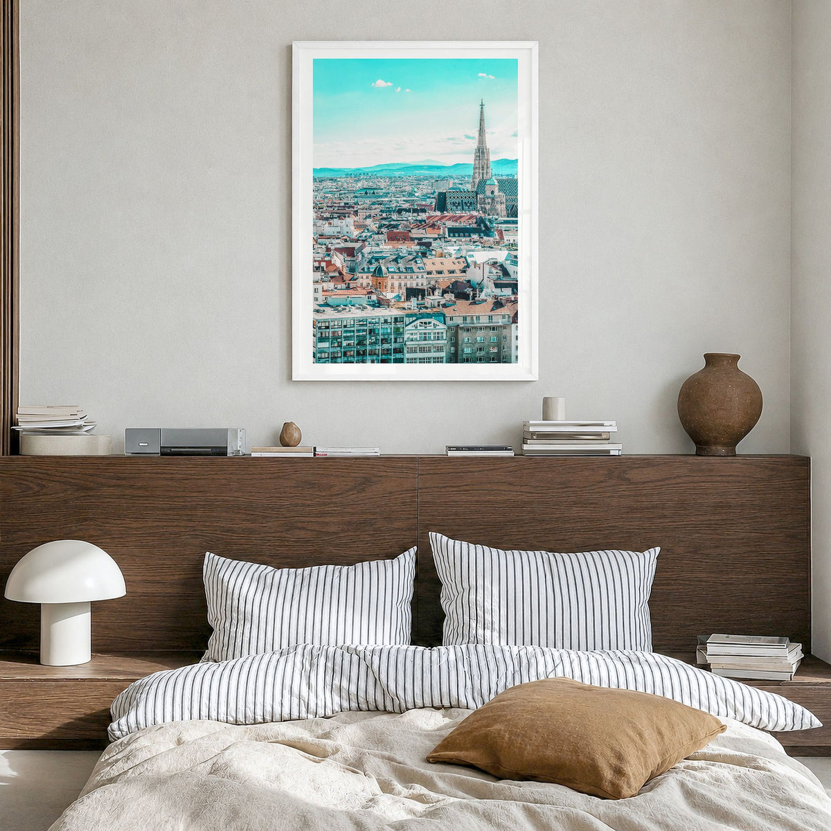 Vienna Photo Poster in a white wood frame, hanging in a bedroom, white border