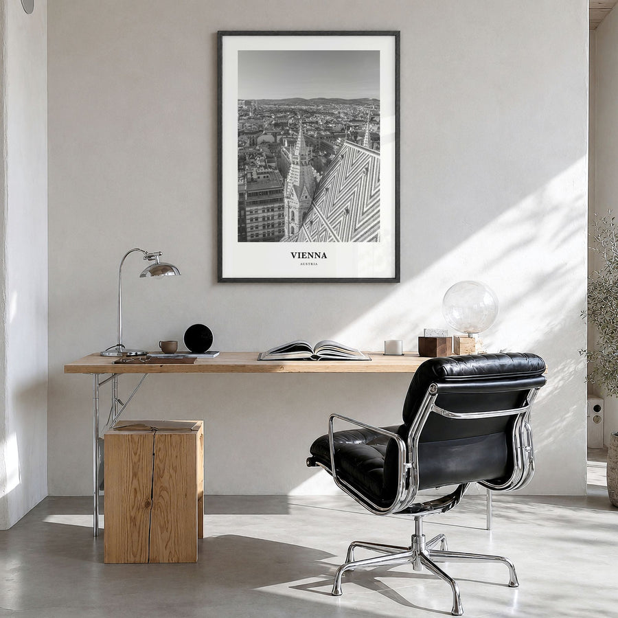 Vienna Classic No 2 Poster in a black wood frame, hanging in a bright home office