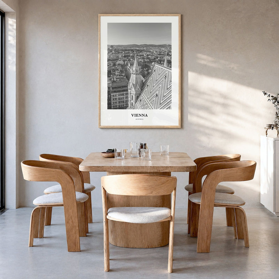 Vienna Classic No 2 Poster in a natural wood frame, hanging in a dining room