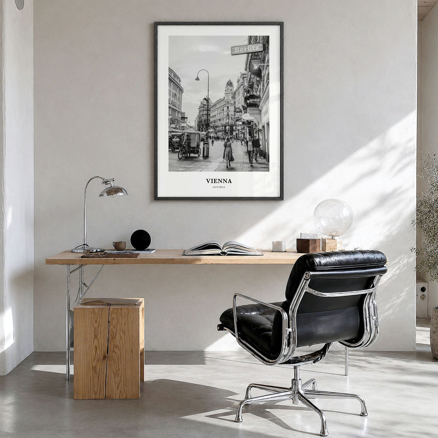 Vienna Classic No 3 Poster in a black wood frame, hanging in a bright home office