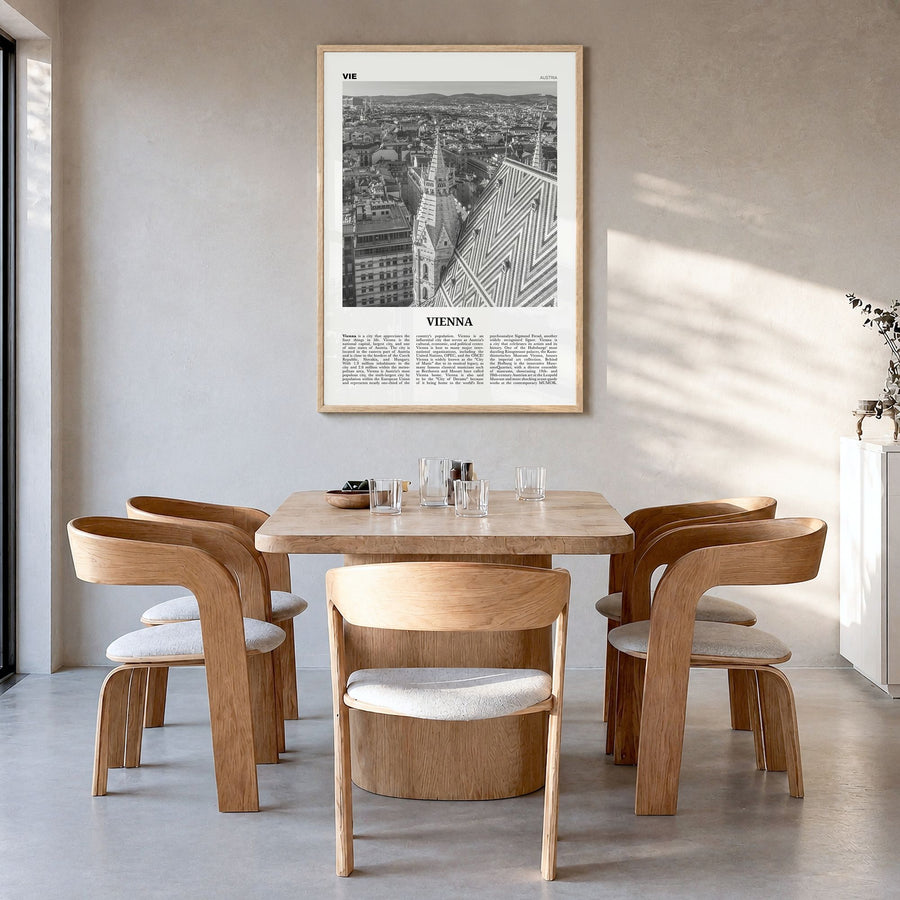 Vienna Newspaper No 3 Poster in a natural wood frame, hanging in a dining room