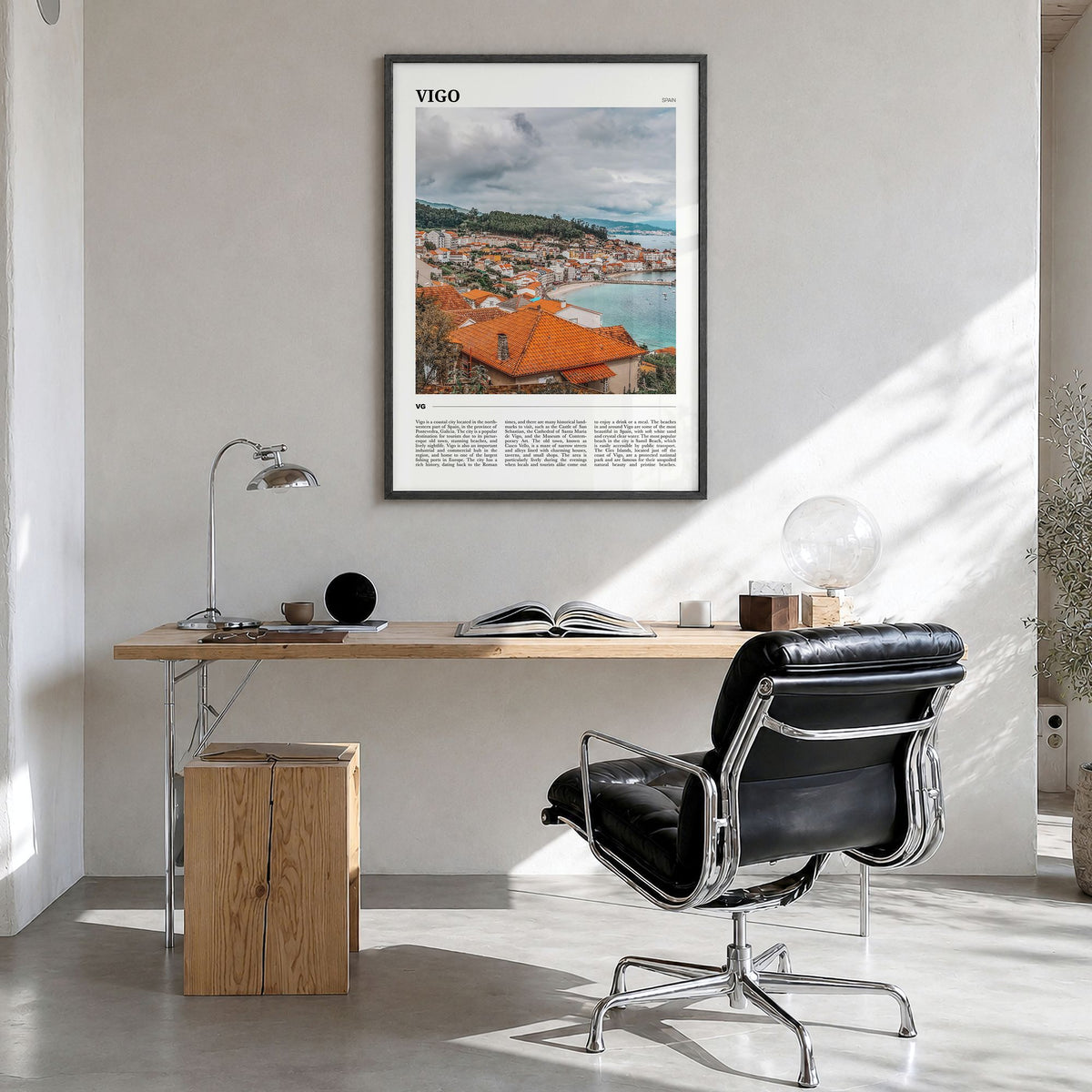 Vigo Travel Poster in a black wood frame, hanging in a bright home office