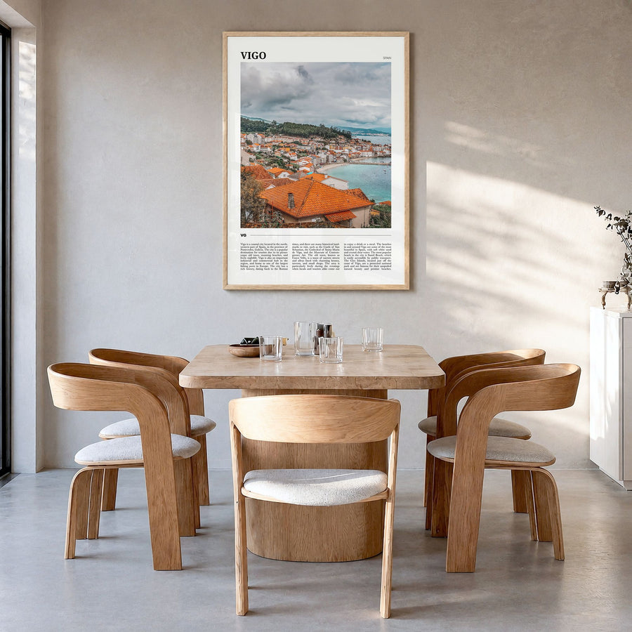 Vigo Travel Poster in a natural wood frame, hanging in a dining room