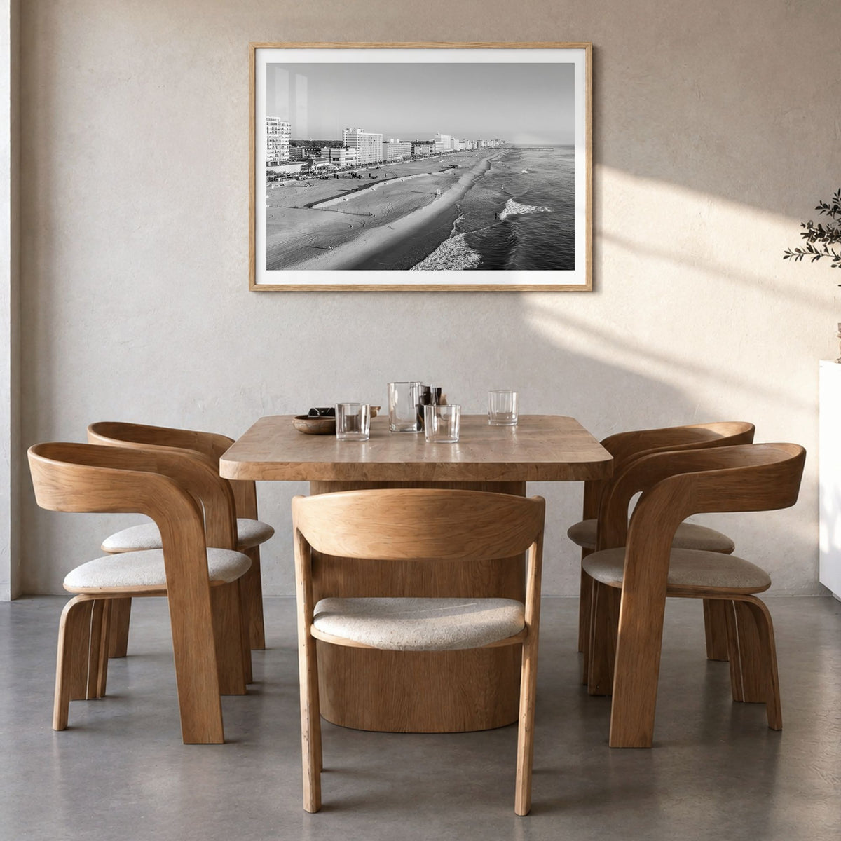 Virginia Beach Photo Poster in a natural wood frame, hanging in a dining room, white border
