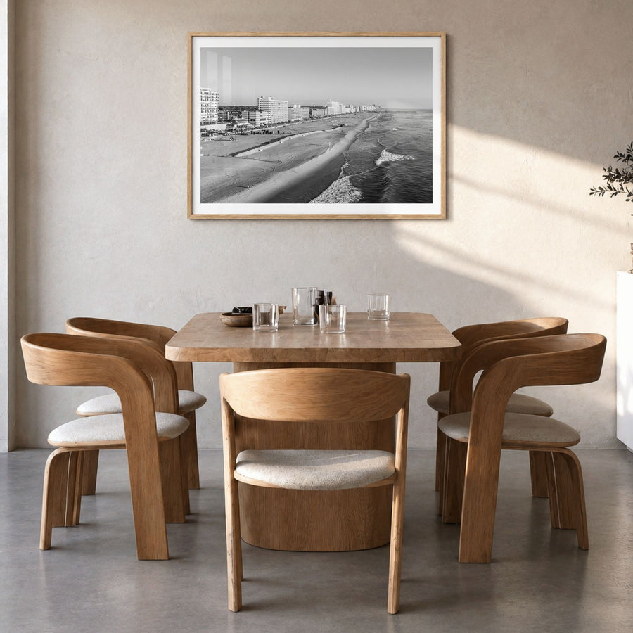 Virginia Beach Photo Poster in a natural wood frame, hanging in a dining room, white border
