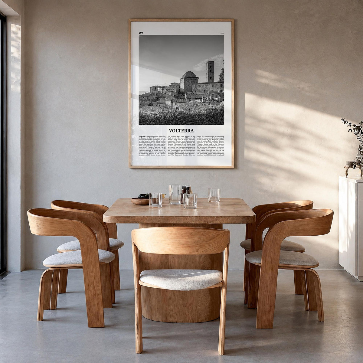 Volterra black & white newspaper poster of Italy – vertical wall art in natural wood frame, hanging on wall