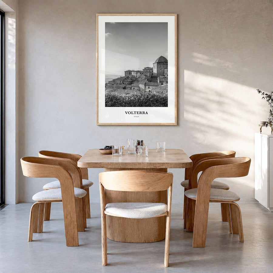 Volterra Classic Poster in a natural wood frame, hanging in a dining room