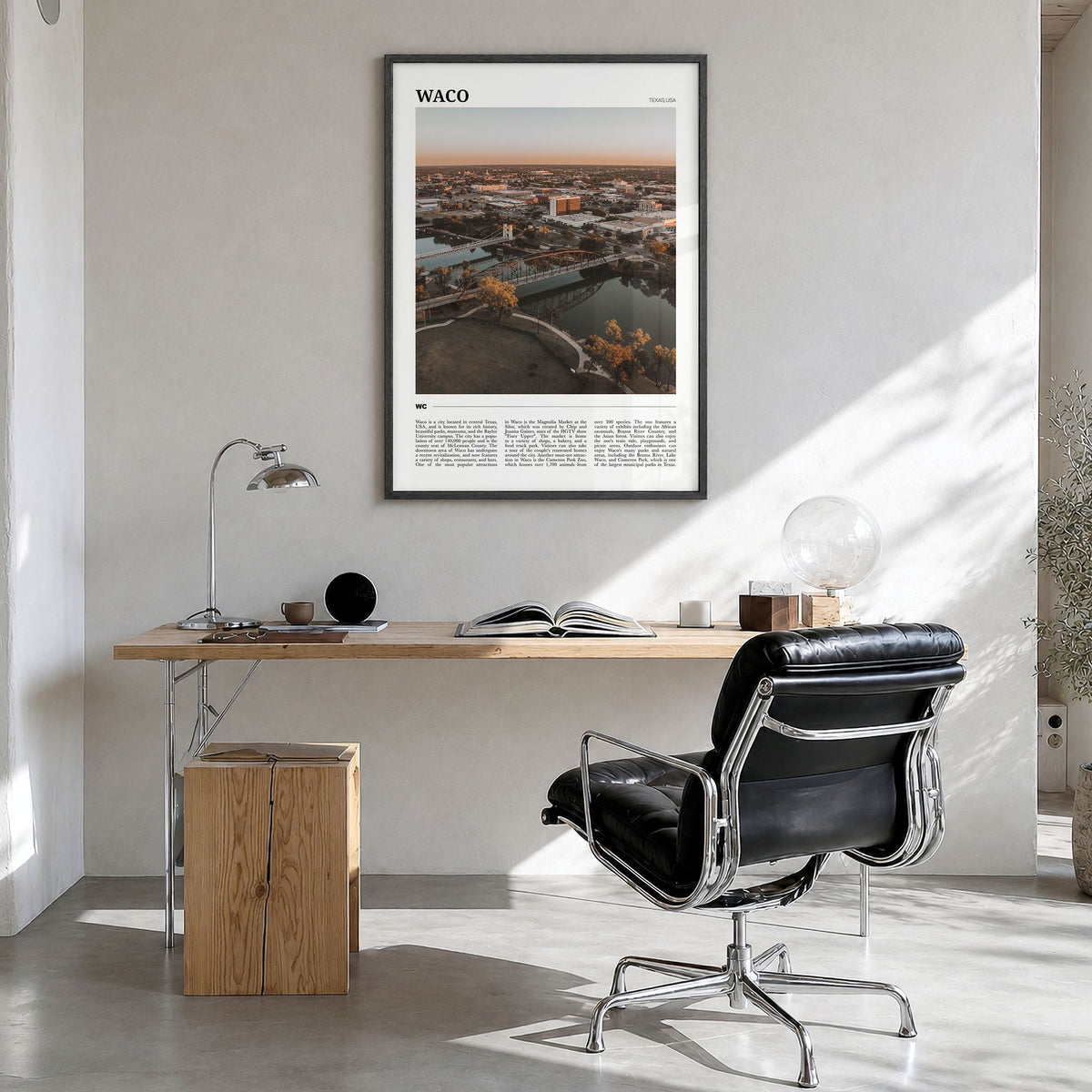 Waco Travel Poster in a black wood frame, hanging in a bright home office