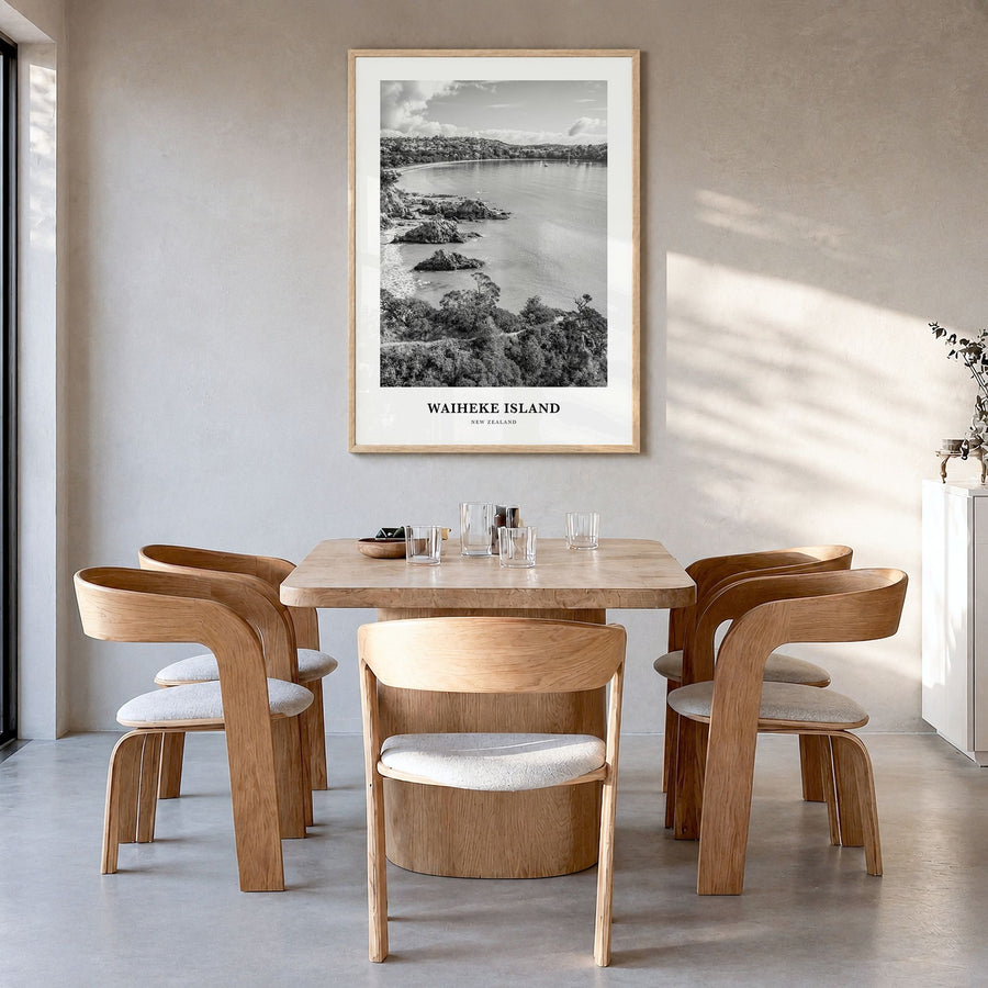 Waiheke Island Classic Poster in a natural wood frame, hanging in a dining room