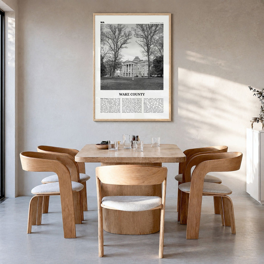 Wake County Newspaper Poster in a natural wood frame, hanging in a dining room