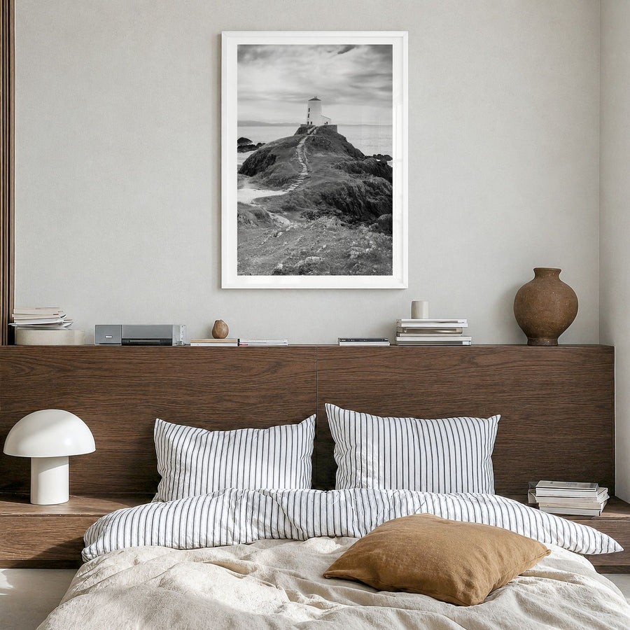 Wales Photo Poster in a white wood frame, hanging in a bedroom, white border