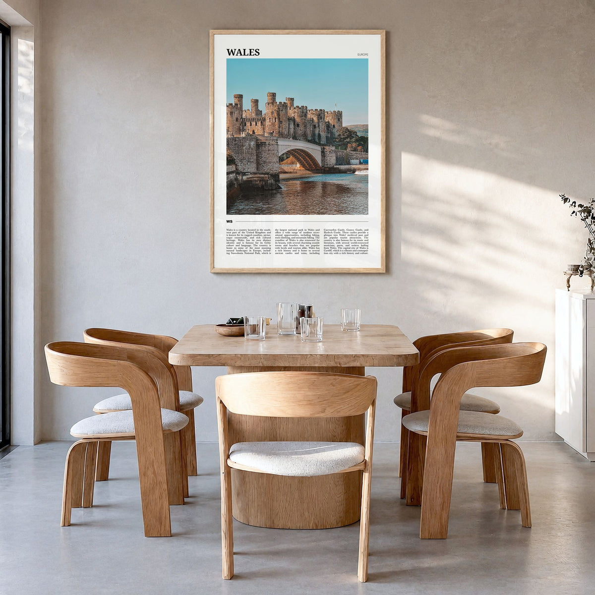 Wales Travel Poster in a natural wood frame, hanging in a dining room