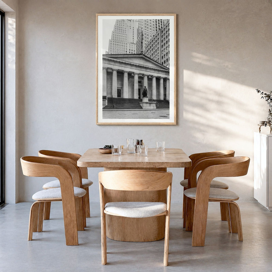 Wall Street Photo Poster in a natural wood frame, hanging in a dining room, white border