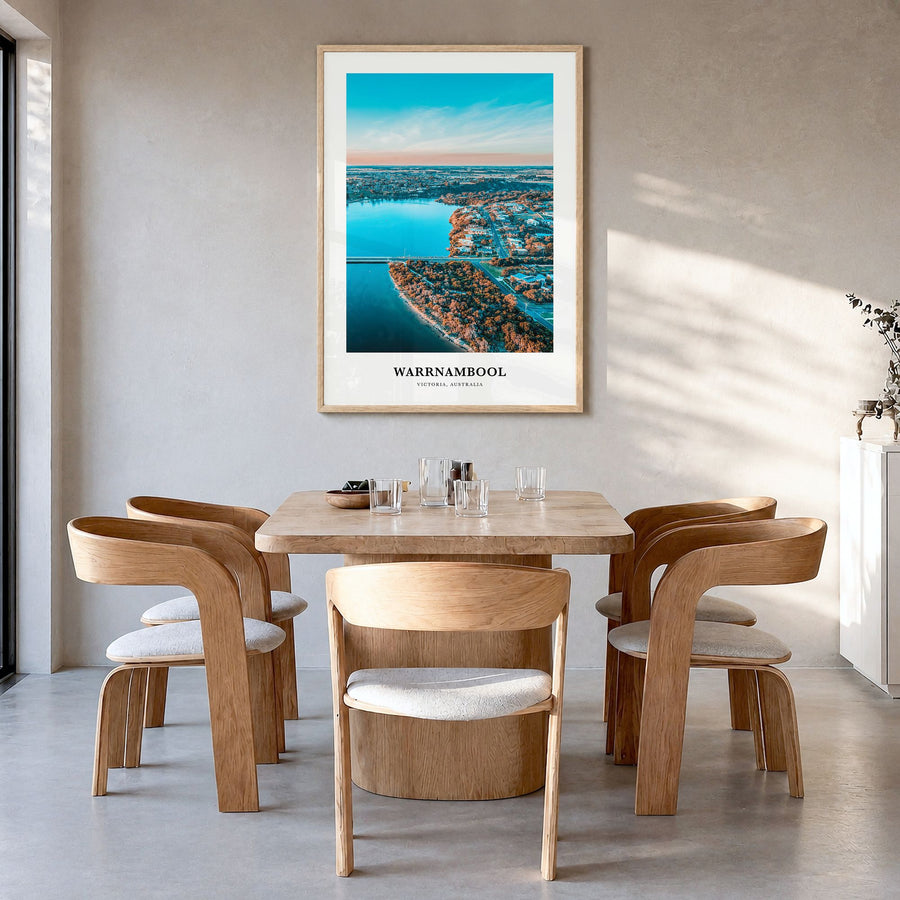 Warrnambool Classic Poster in a natural wood frame, hanging in a dining room