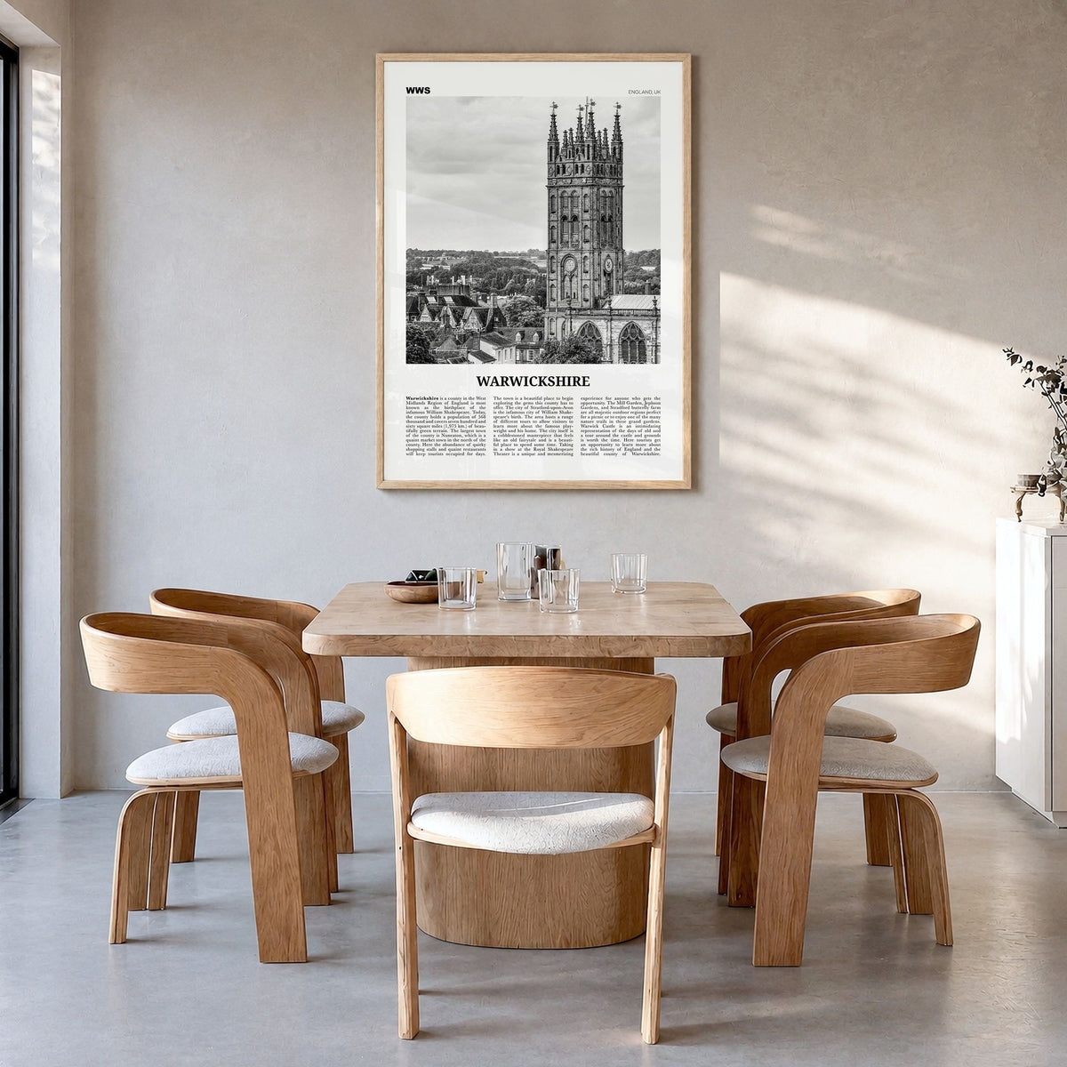 Warwickshire Newspaper Poster in a natural wood frame, hanging in a dining room