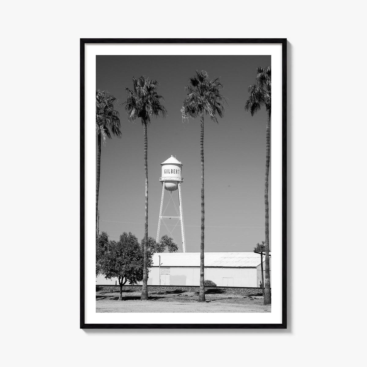 Water Tower no. 2 black & white photo poster – vertical wall art, unframed print shown in interior mockup