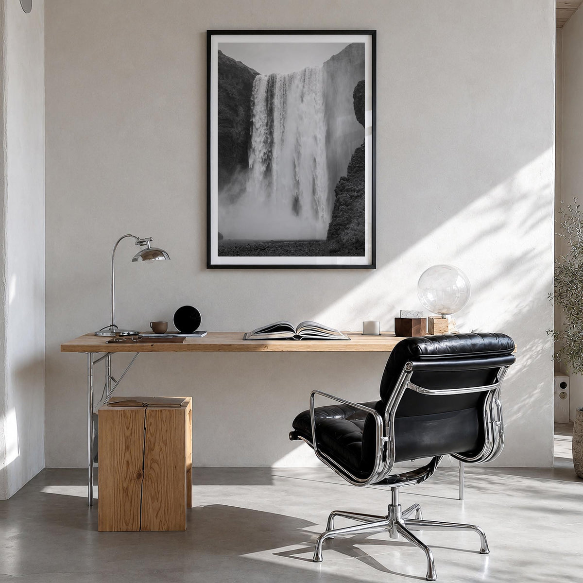 Waterfall no. 1 black & white photo poster – vertical wall art in black wood frame with white border, hanging on wall