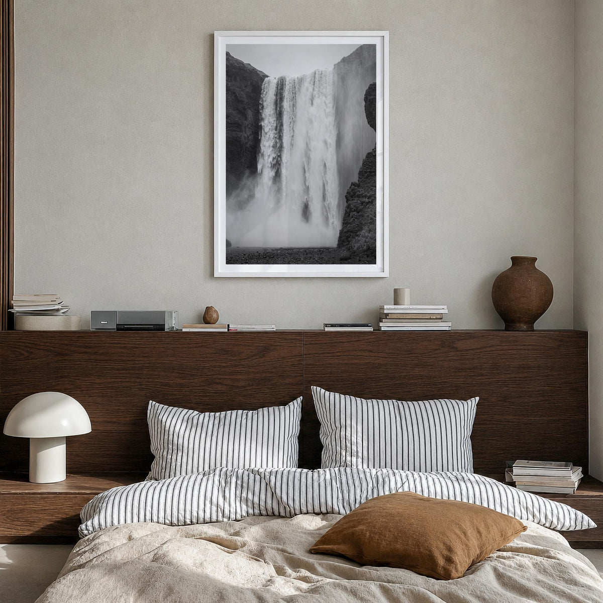 Waterfall no. 1 black & white photo poster – vertical wall art in white wood frame with white border, hanging on wall
