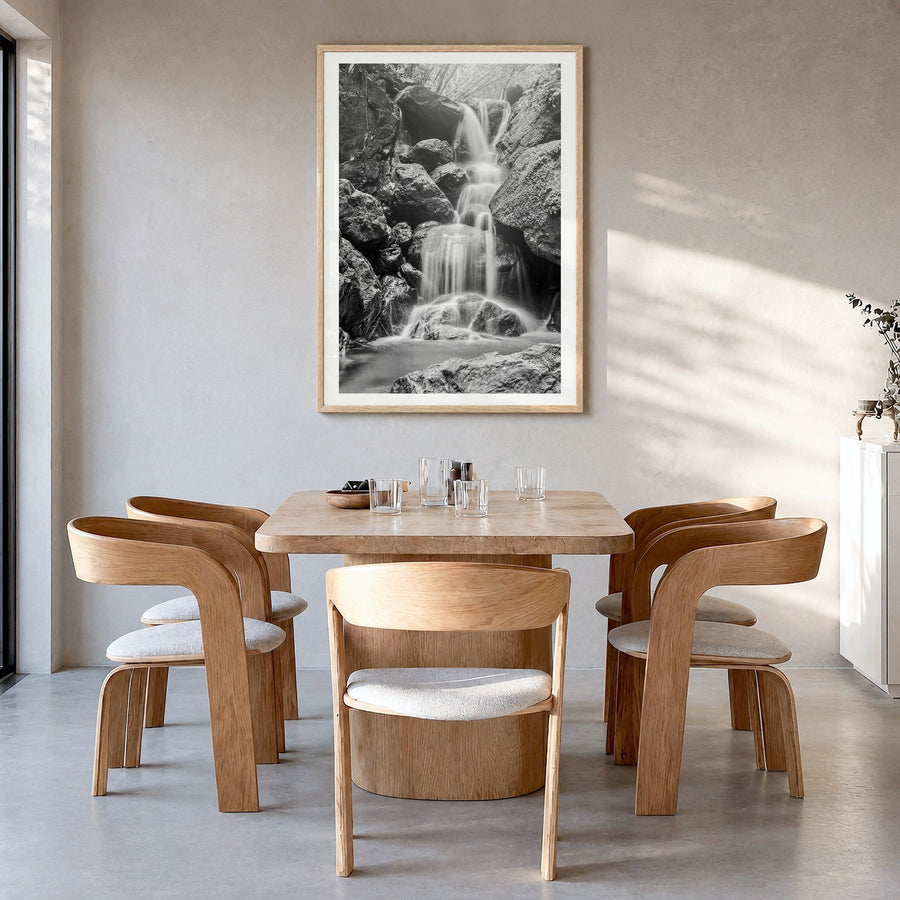 Waterfall Photo No 2 Poster in a natural wood frame, hanging in a dining room, white border