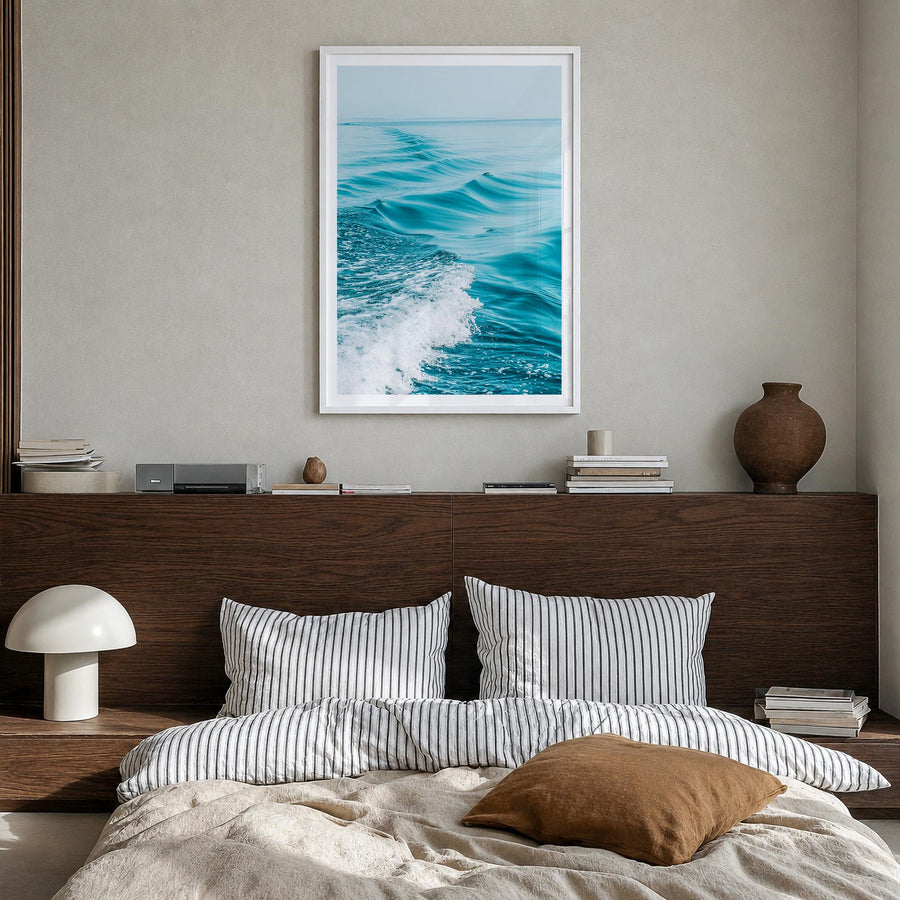 Waves at Sea colorful photo poster – vertical wall art in white wood frame with white border, hanging on wall