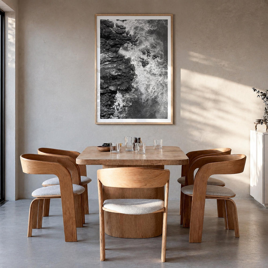 Waves Crashing no. 1 black & white photo poster – vertical wall art in natural wood frame with white border, hanging on wall