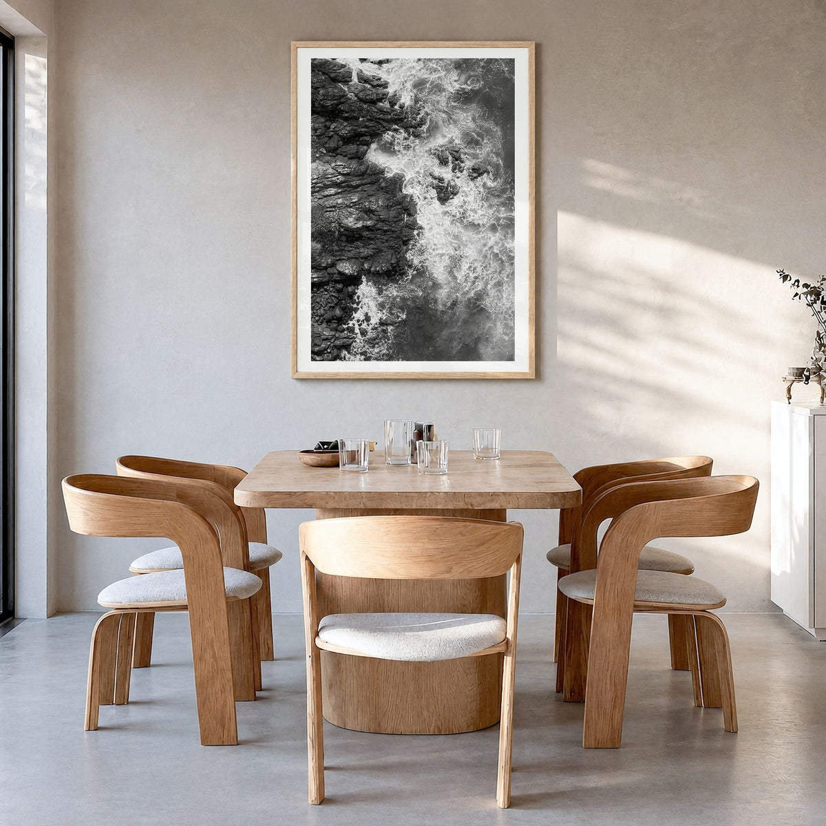 Waves Crashing Photo No 1 Poster in a natural wood frame, hanging in a dining room, white border