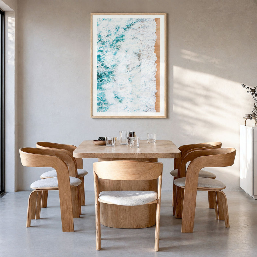 Waves Crashing Photo No 1 Poster in a natural wood frame, hanging in a dining room, white border