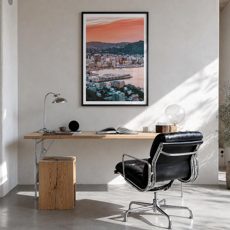 Wellington colorful photo poster of New Zealand – vertical wall art in black wood frame with white border, hanging on wall
