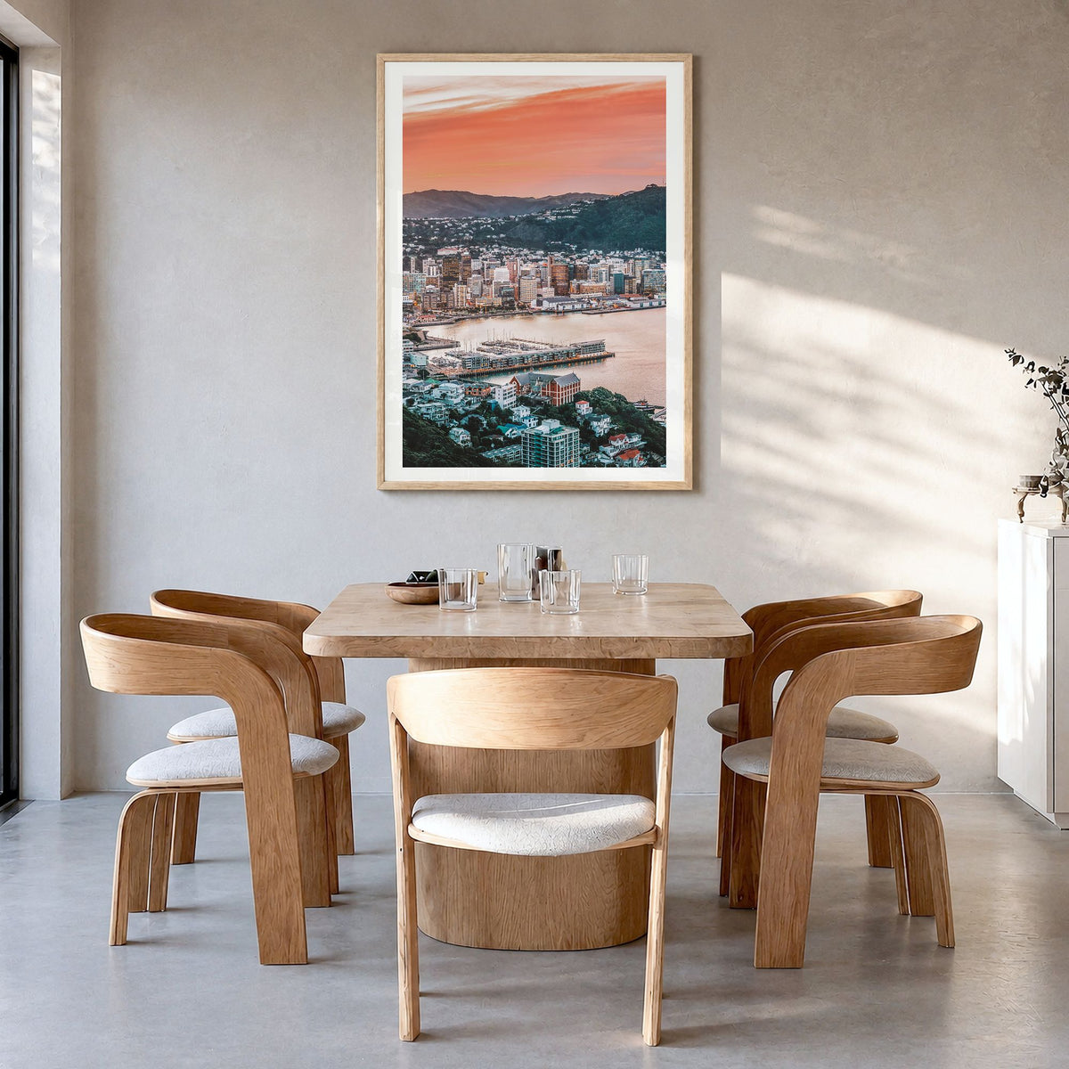 Wellington Photo Poster in a natural wood frame, hanging in a dining room, white border