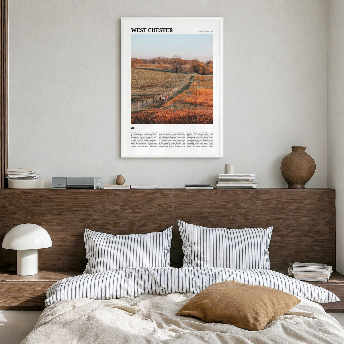 West Chester, Pennsylvania Travel Poster in a white wood frame, hanging in a bedroom